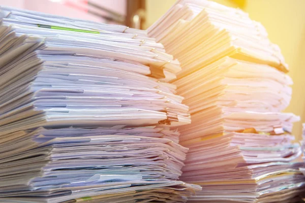 Documents on desk stack up high waiting to be managed — Stock Photo, Image