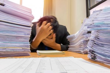 documents on desk stack up high waiting to be managed clipart