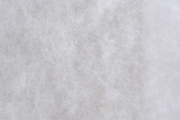 不織布の白い芸術パターン背景の生地テクスチャ — ストック写真