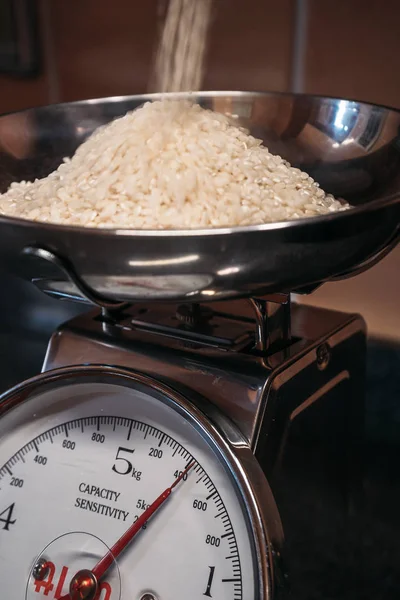 Metal scale weighing rice. Kitchen Concept — Stock Photo, Image