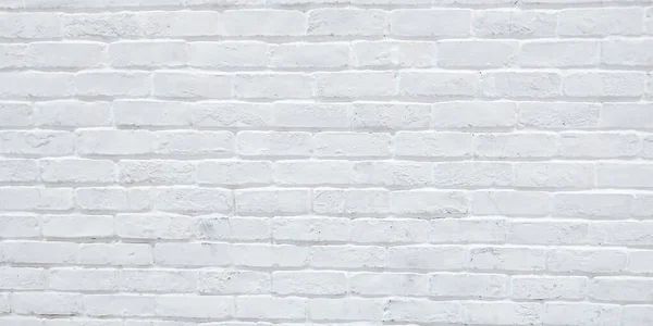 Modern white brick wall texture background for wallpaper and graphic web design . White brick wall background. Neutral texture of a flat brick wall close-up.