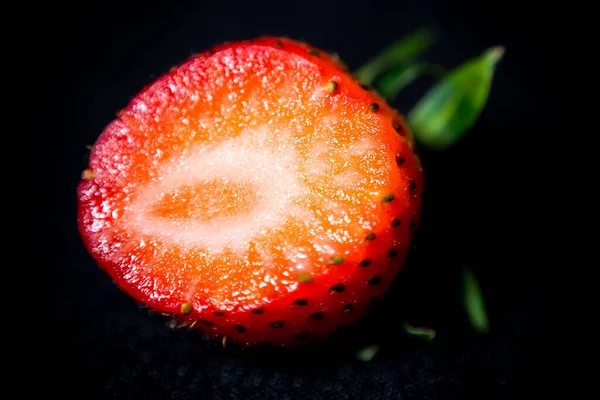 large strawberries on a black background