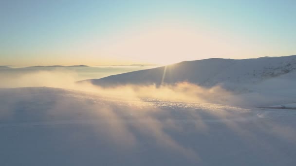 Beautiful misty sunrise in the mountains with snow ridge and clear blue sky — Stock Video