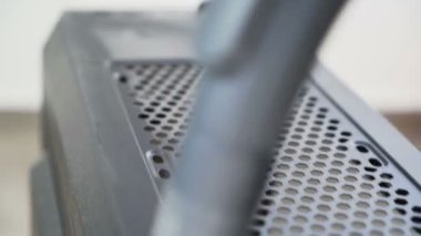 Male hands using vacuum cleaner to clean PC, desktop computer case