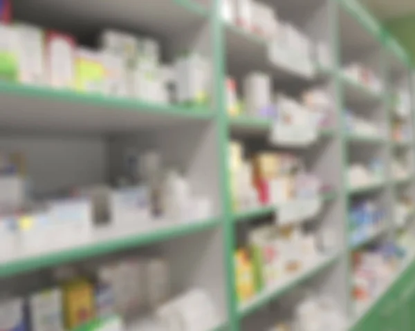 cabinets and shelves with medicines in a pharmacy. blurry