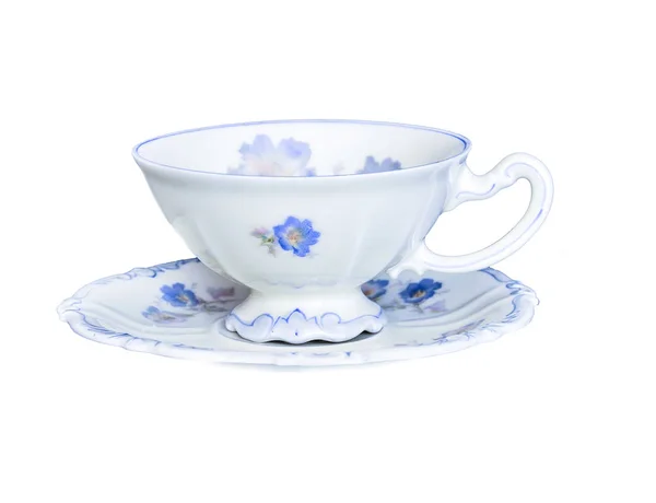 Elegant porcelain tea cup on saucer isolated on white background Stock Picture