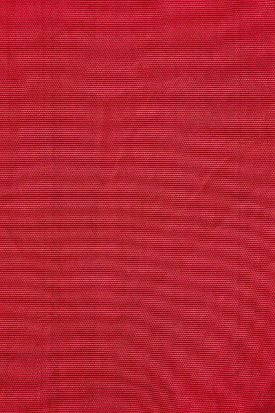 Texture of red nylon fabric - aviation tarpaulin close up