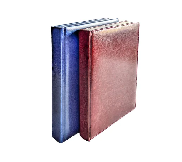 Upright two red and blue leather hardcover diaries isolated — Stockfoto