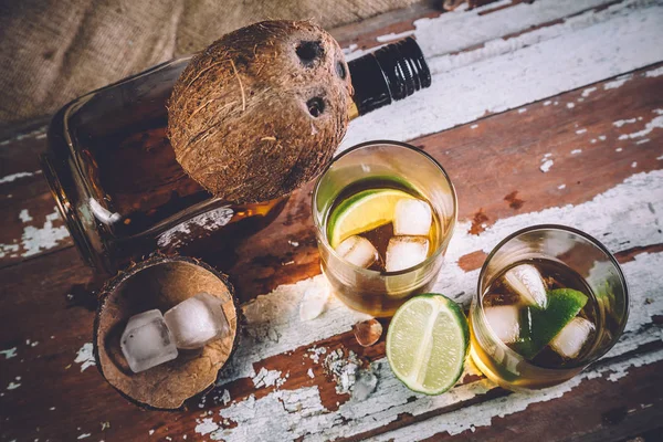 Whiskey with ice, a bottle of rum tequila... — Stock Photo, Image