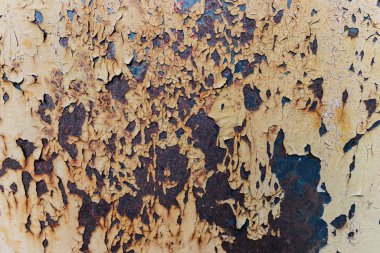 Eski boyalarla kaplı paslı metal yüzey. Duvar kağıdı için desenli arkaplan.