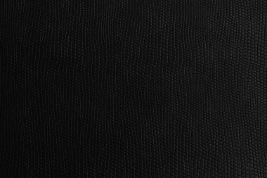 Benekli kabartmalı doku koyu siyah minimalist renklerde. Deri kumaş konsepti.