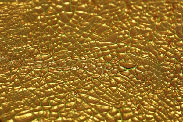画布宏观背景上裂开的金色颜料质量很高 — 图库照片