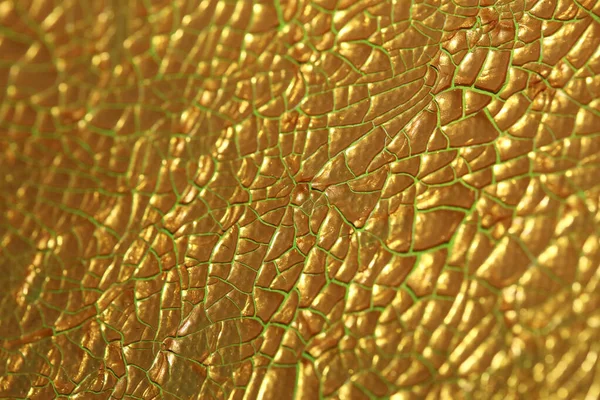 Cracked golden paint on canvas macro background high quality fif — ストック写真