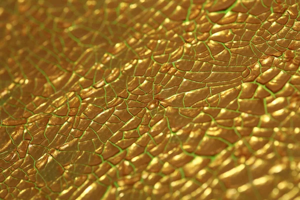 Cracked golden paint on canvas macro background high quality fif — ストック写真