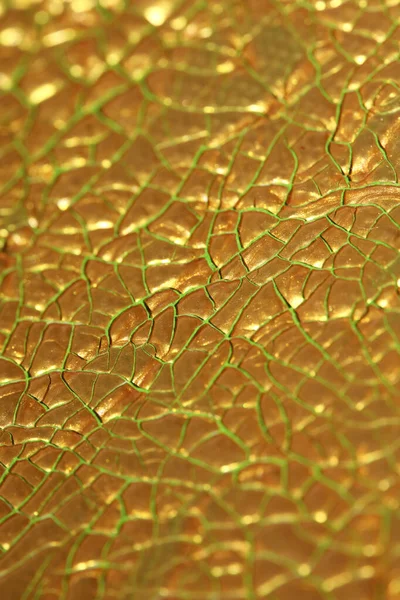 Sprucken gyllene färg på duk makro bakgrund hög kvalitet fif — Stockfoto