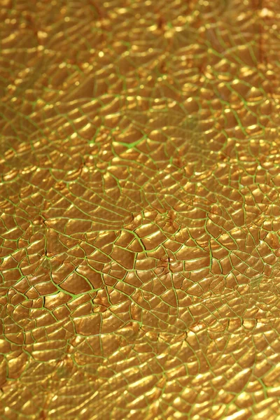 Cracked golden paint on canvas macro background high quality fif — ストック写真