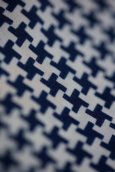 Textile design with black and white crosses macro background hig — 스톡 사진