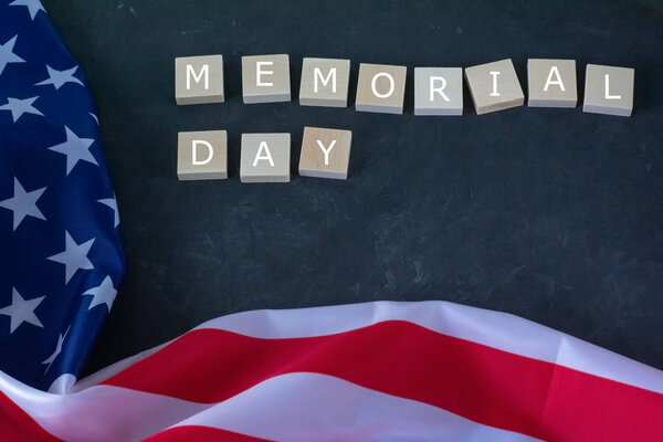 Memorial Day. American flag and the inscription on a black background