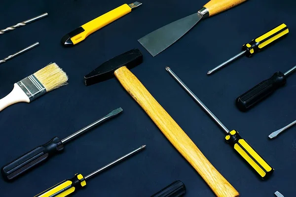 Flat lay with various hand construction tools on a black background. Labor day background concept — Stock Photo, Image
