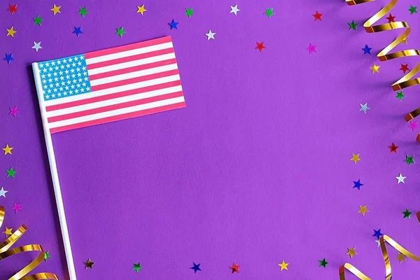 US Independence Day. USA flag on a festive purple background. Th