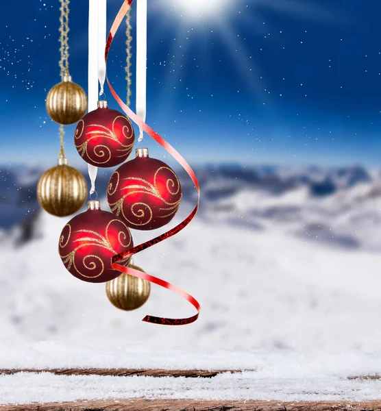 Christmas balls with wood and mountain — Stock Photo, Image