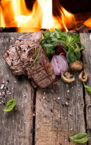 Beef steak on woode table — Stock Photo, Image