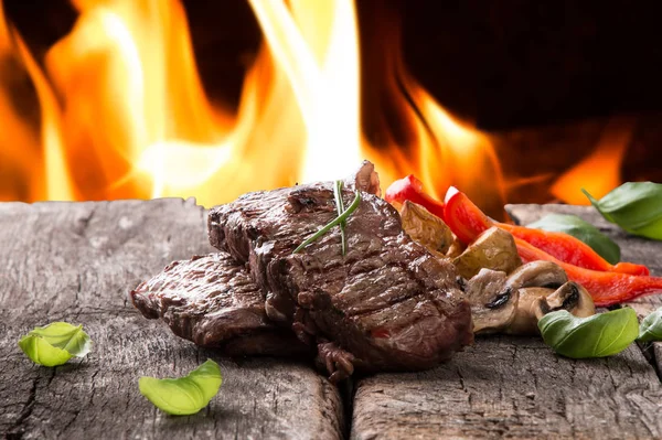 Beef steak on woode table — Stock Photo, Image