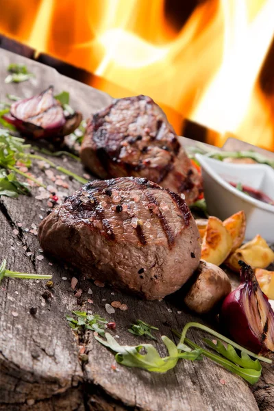 Beef steak on woode table — Stock Photo, Image