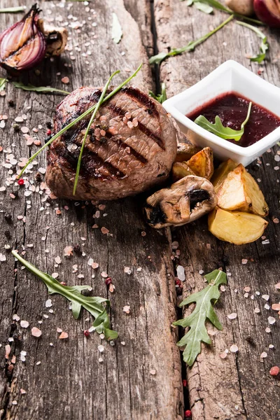 Beef steak on woode table — Stock Photo, Image