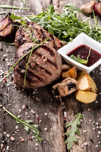 Beef steak on woode table — Stock Photo, Image