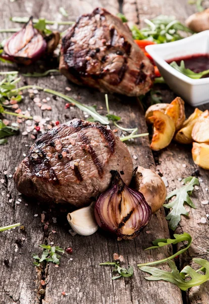 Beef steak on woode table — Stock Photo, Image