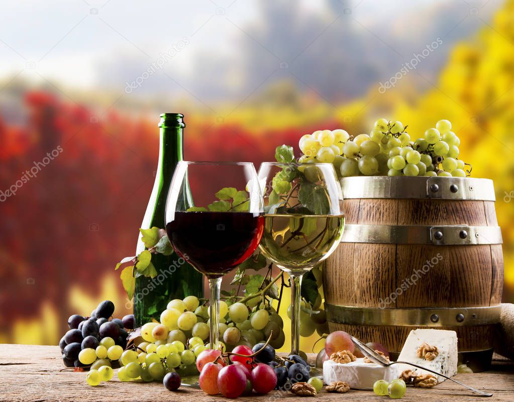 Wine glass on wooden barrel with nature background