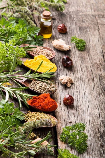 Herbs and spices with nature mint and thyme on wooden table. Kitchen concept.