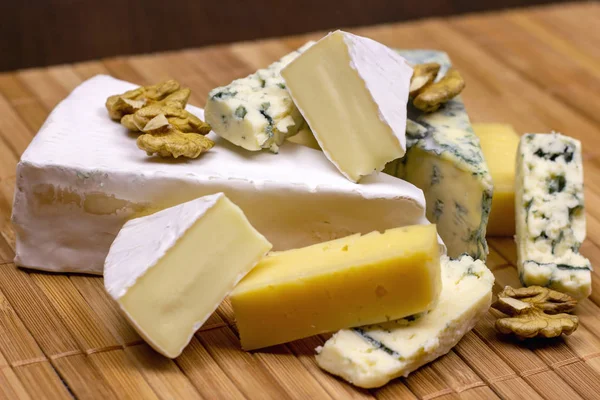 Many Different Varieties Cheese Blue Brie Camembert Other Walnuts Wooden — Stock Photo, Image