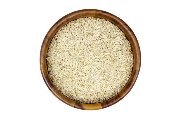 Beyaz Arka Planda Ahşap Bir Kasede Pişmemiş Kahverengi Pirinç — Stok fotoğraf