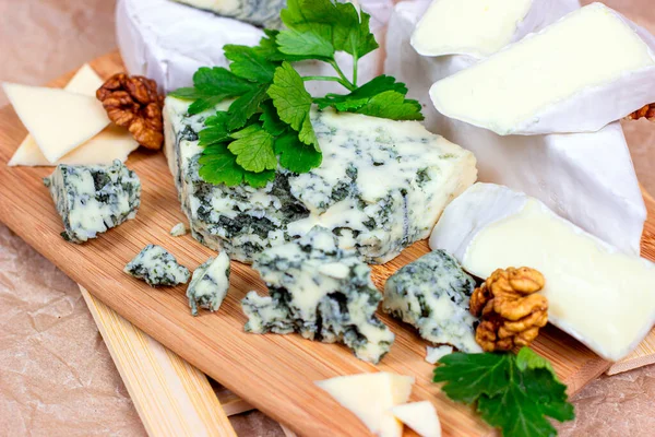 Many Different Varieties Cheese Blue Brie Camembert Other Walnuts Wooden — Stock Photo, Image