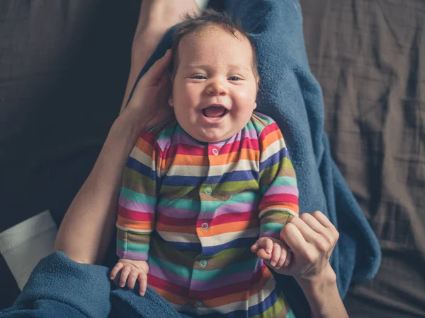 Happy babyb in mothers lap — Stock Photo, Image