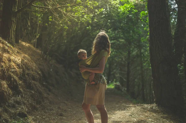 Young Mother Her Baby Sling Standing Clearing Forest Sunny Day — Stock Photo, Image