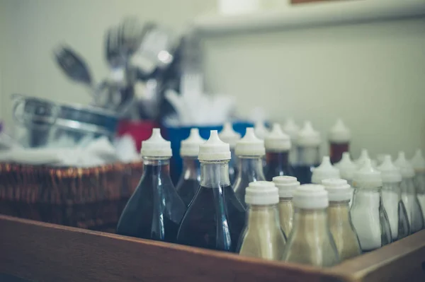 Bottles of sauce and condiments — Stock Photo, Image