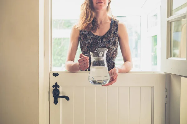 Young Woman Standing Stable Door Jug Water Sunny Day — Stock Photo, Image