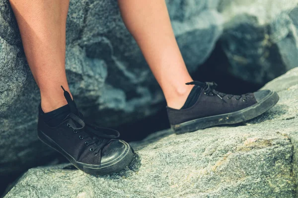 Feet Young Woman Wearing Black Shoes Sitting Rock — Stock Photo, Image