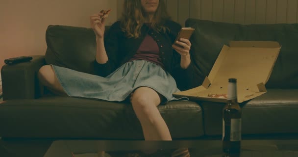 Young Woman Sitting Her Sofa Home Using Her Smartphone — Stock Video