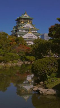 Osaka Castle park in Osaka, Japan, vertical 4k