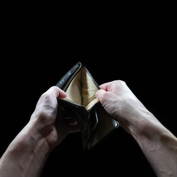 hand with empty wallet isolated on black , bankruptcy, debt, mortgage concept