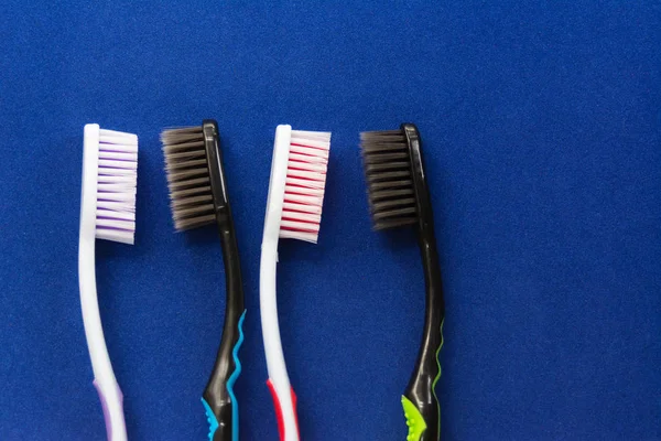 Toothbrushes Multicolored Bright Blue Background Close — Stock Photo, Image