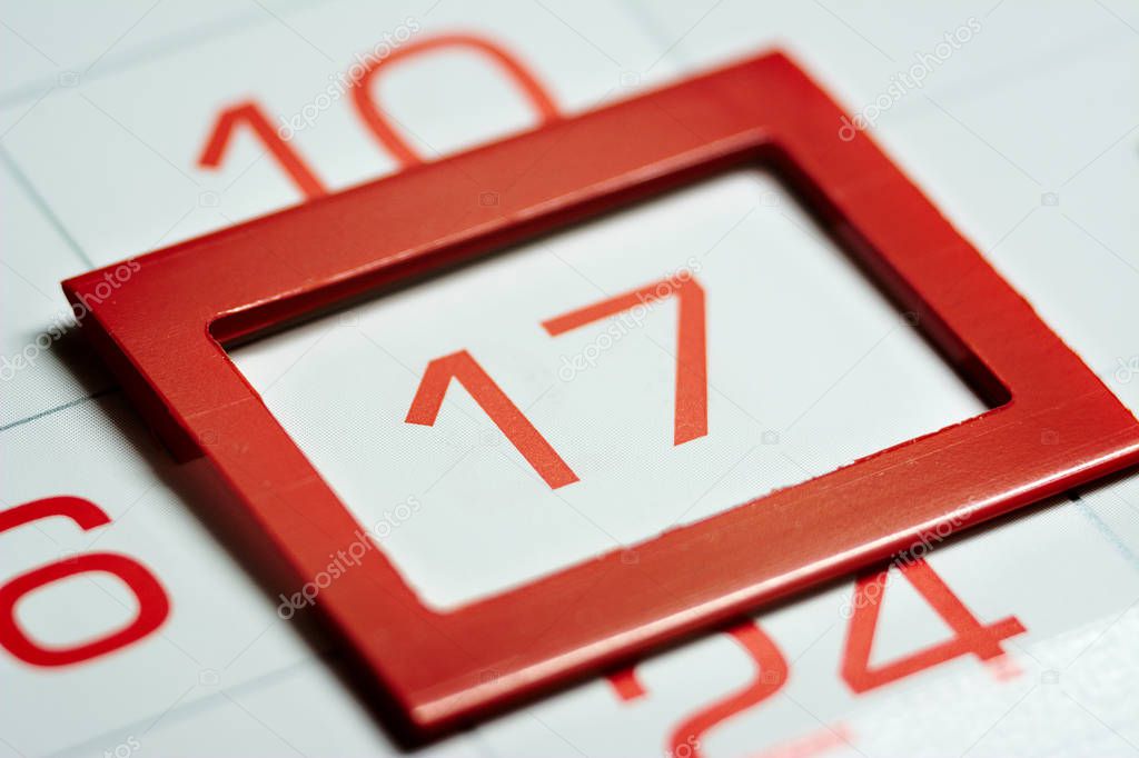 seventeenth of the month highlighted on the calendar with a red frame close-up macro, mark on the calendar, seventeenth date