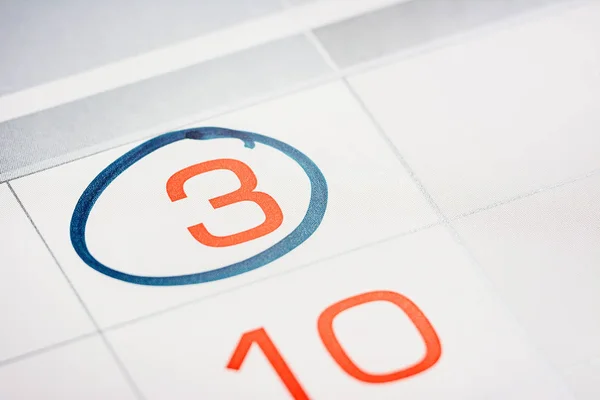 the third day of the month highlighted on the calendar with a frame close-up macro, mark on the calendar, the third date