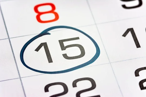 fifteenth of the month highlighted on the calendar with a frame close-up macro, mark on the calendar, fifteenth date