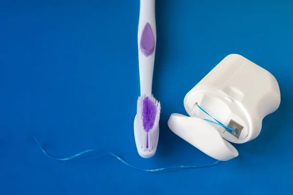 Dental Floss Toothbrush Blue Background Concept Care Oral Cavity Preventing — Stock Photo, Image