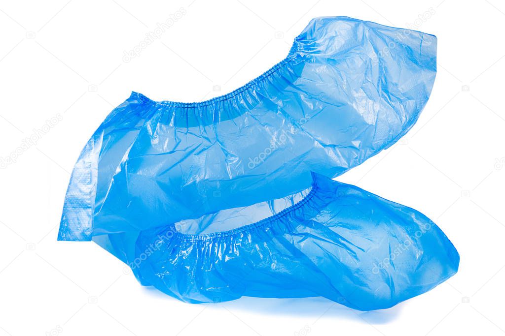 disposable blue shoe covers for hospital visits isolated on white background